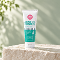 Cathy Doll Acne Oil Control Cleansing Foam on a stone pedestal